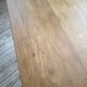 Oak farmhouse table with turned black legs.