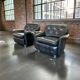 Set of 2 vintage black leather armchairs / individual armchairs