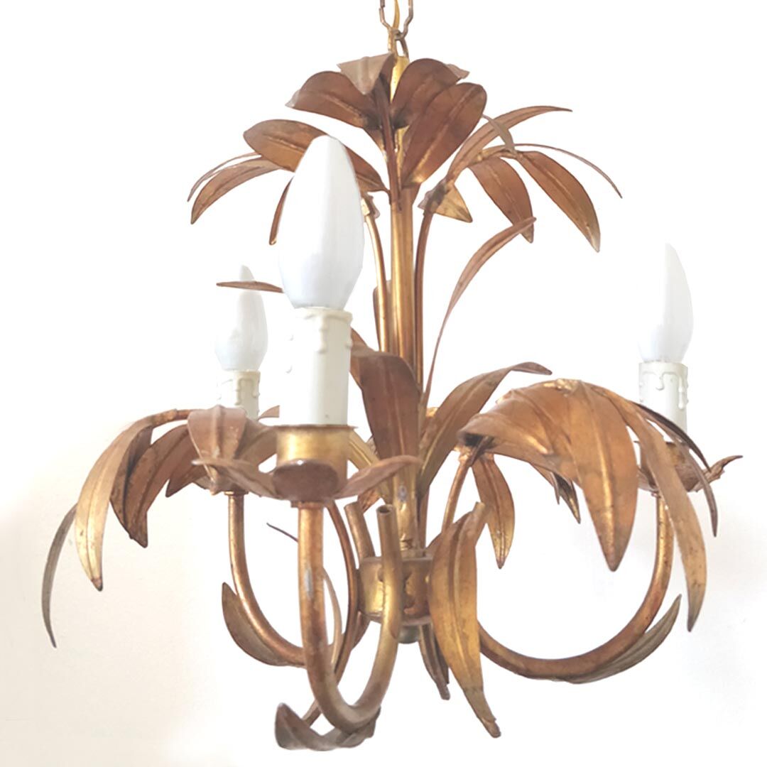 Golden metal chandelier palm leaves