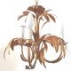 Golden metal chandelier palm leaves