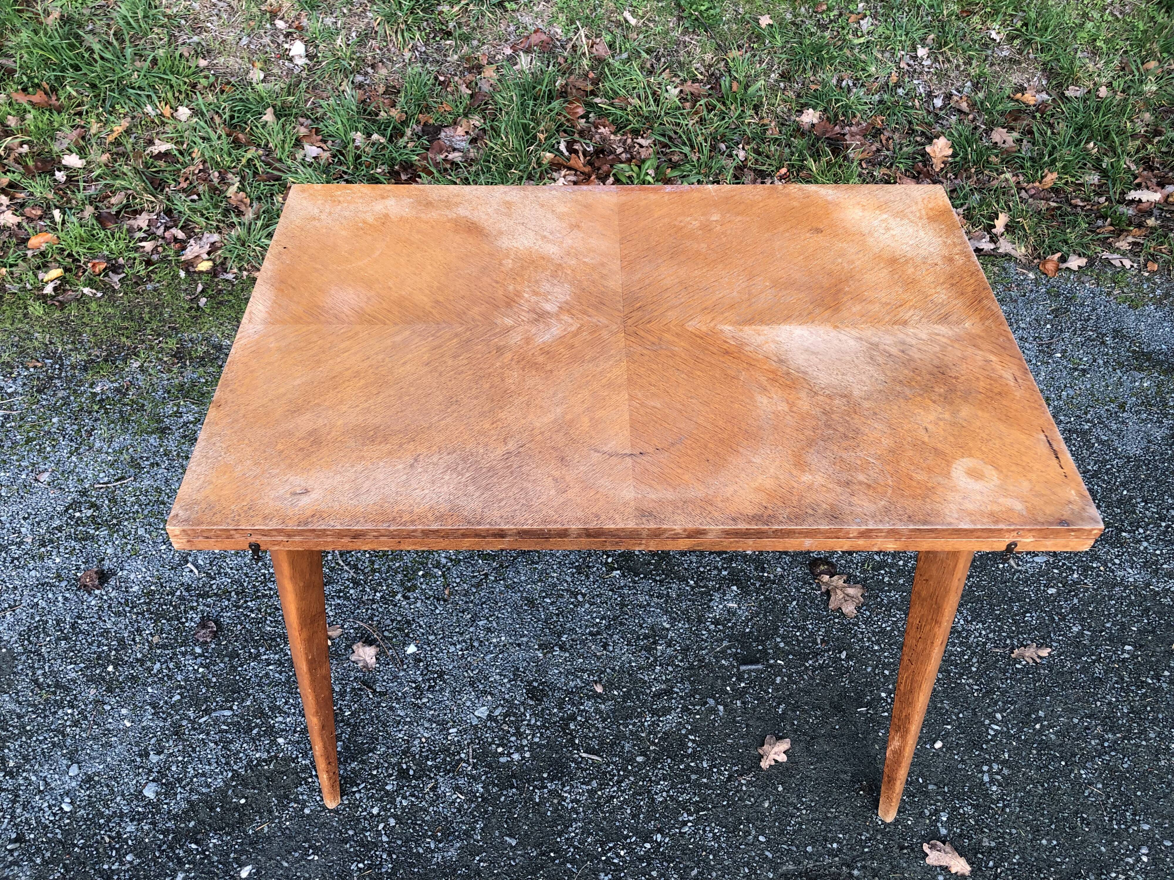 Vintage so-called portfolio table with oak compass base and its oak cp swivel top.