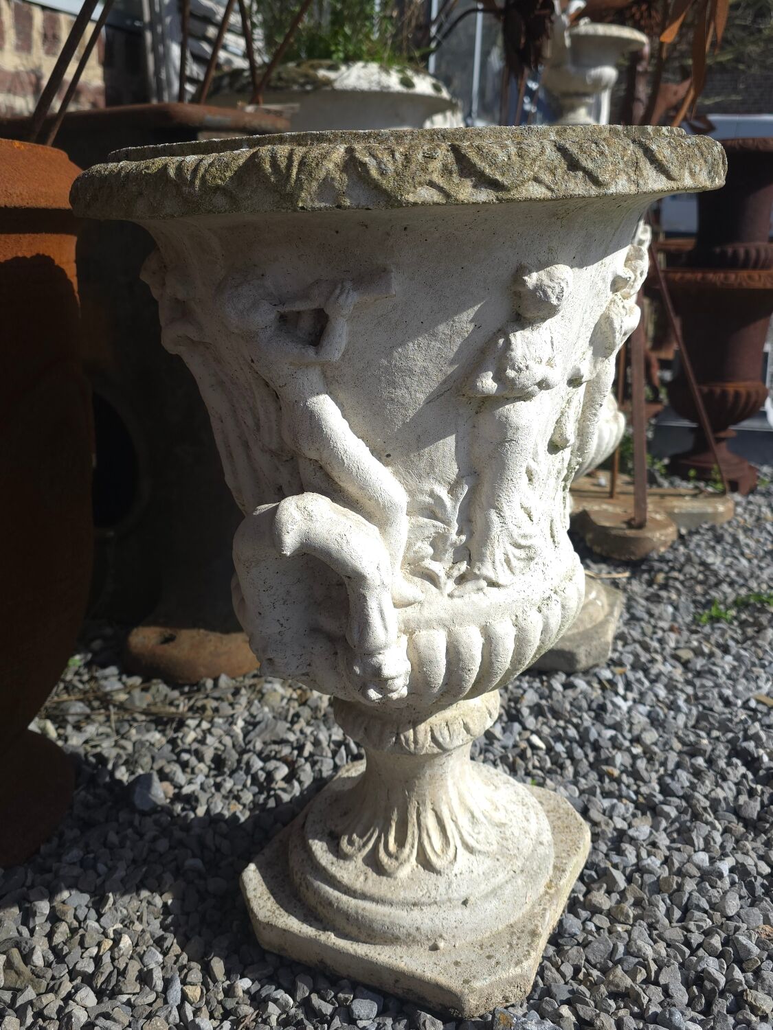 Medical vases with characters in reconstituted stone.