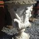 Medical vases with characters in reconstituted stone.