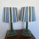 Pair of vintage wooden lamps with their striped beige, blue, and green shades.