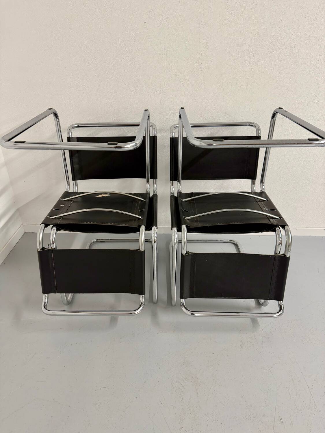 Lot of 4 tubular chairs designed by Mart Stam in vintage black leather from the 1980s.