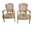 Paire de fauteuils en bois dore style Louis XVl