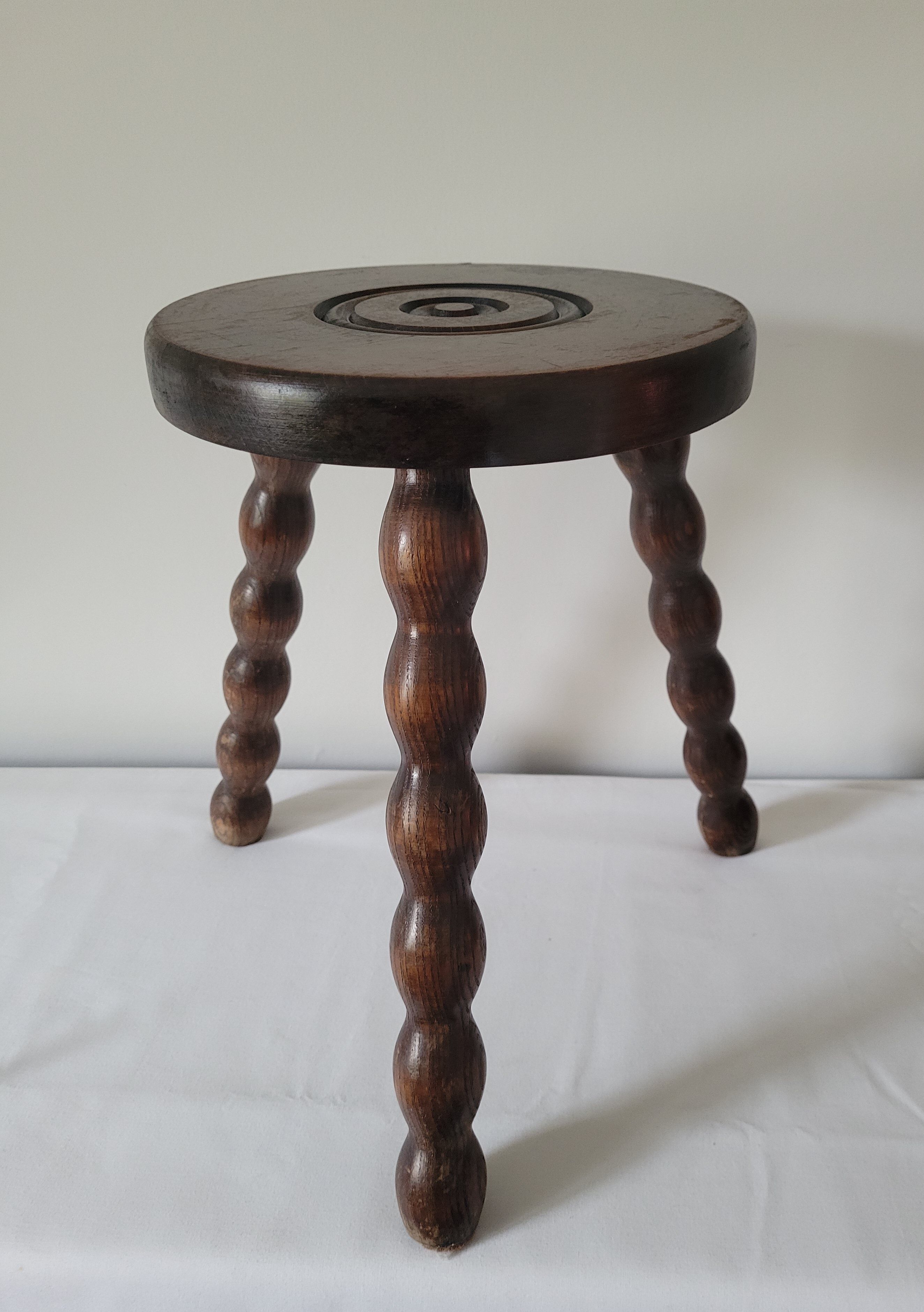 Brutalist stool with turned wooden legs