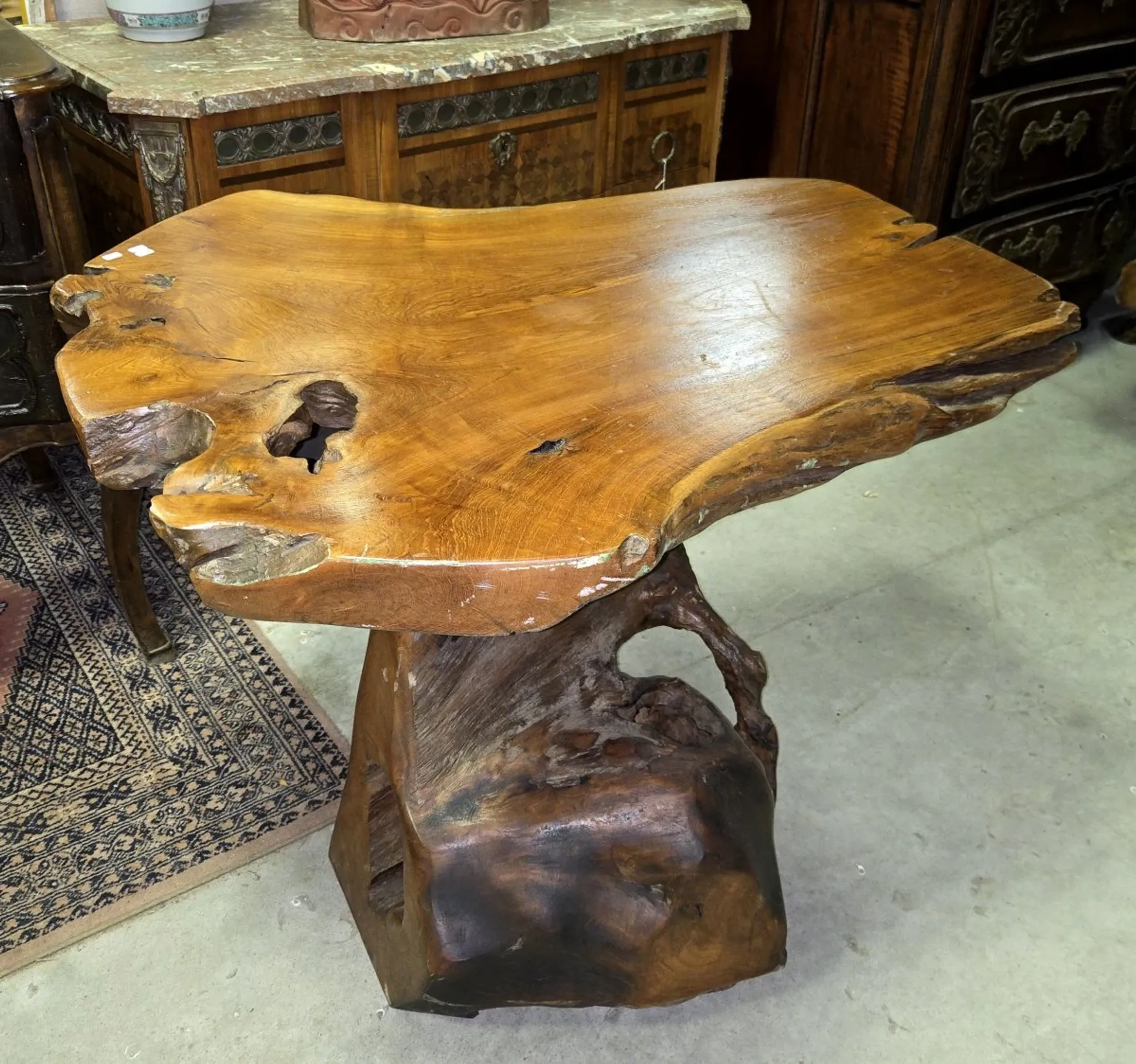 Sculpted olive wood table, made from a root.