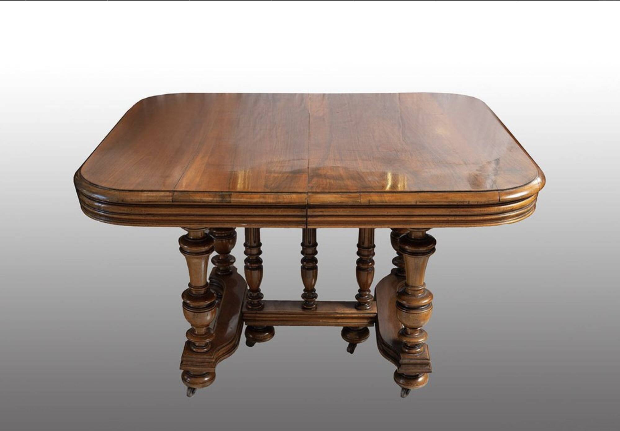 Extendable wheeled table henri ii, second half of the 19th century, solid walnut.