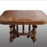 Extendable wheeled table henri ii, second half of the 19th century, solid walnut.