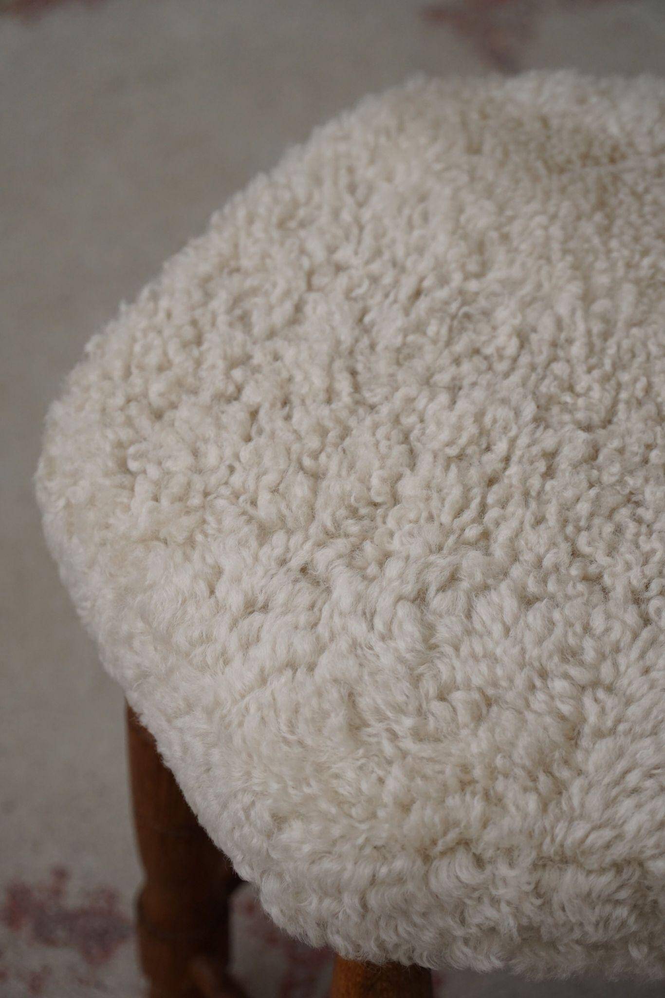 Modern Danish, a hexagonal oak stool, seat reupholstered in lambswool, 1950s.