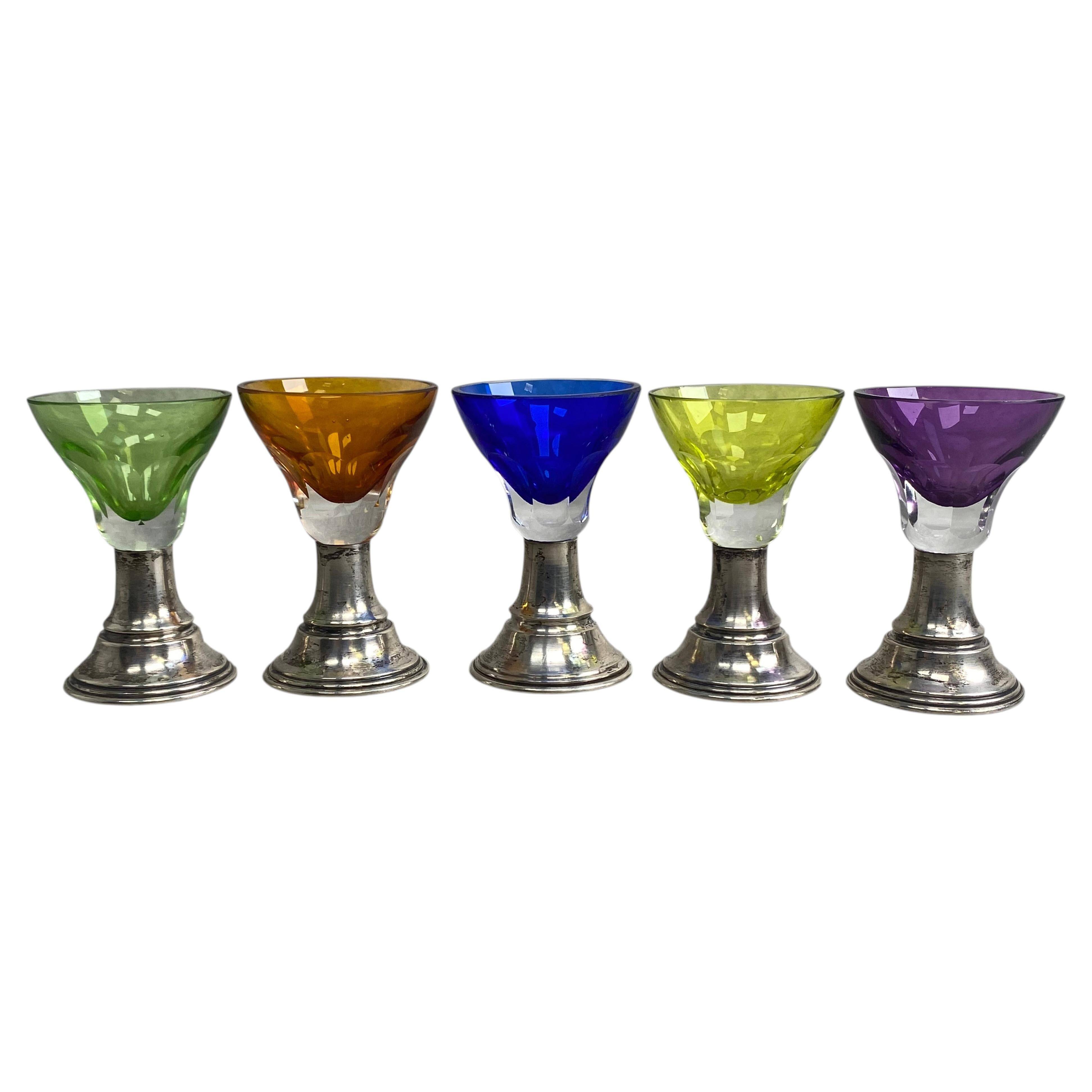 Set of 5 coloured stemmed glasses on silver stems.