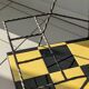 Vintage black and yellow checkered rolling bar trolley
