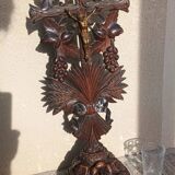Antique wooden crucifix carved from the Black Forest with grapes and leaves.