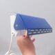 Modernist wall light with a blue pivoting shade from the 1960s.