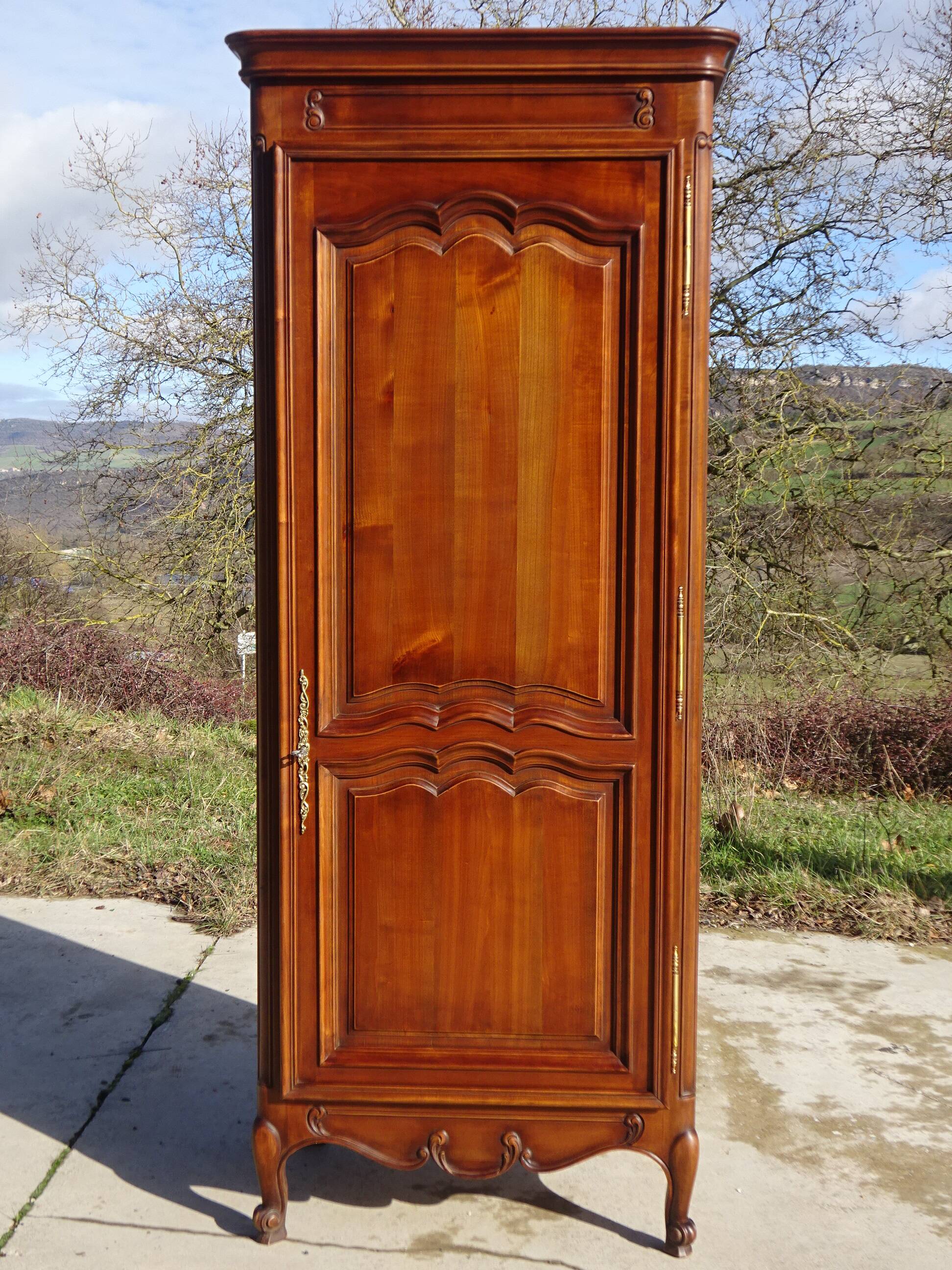 Louis XV style bonnetière in solid cherry wood