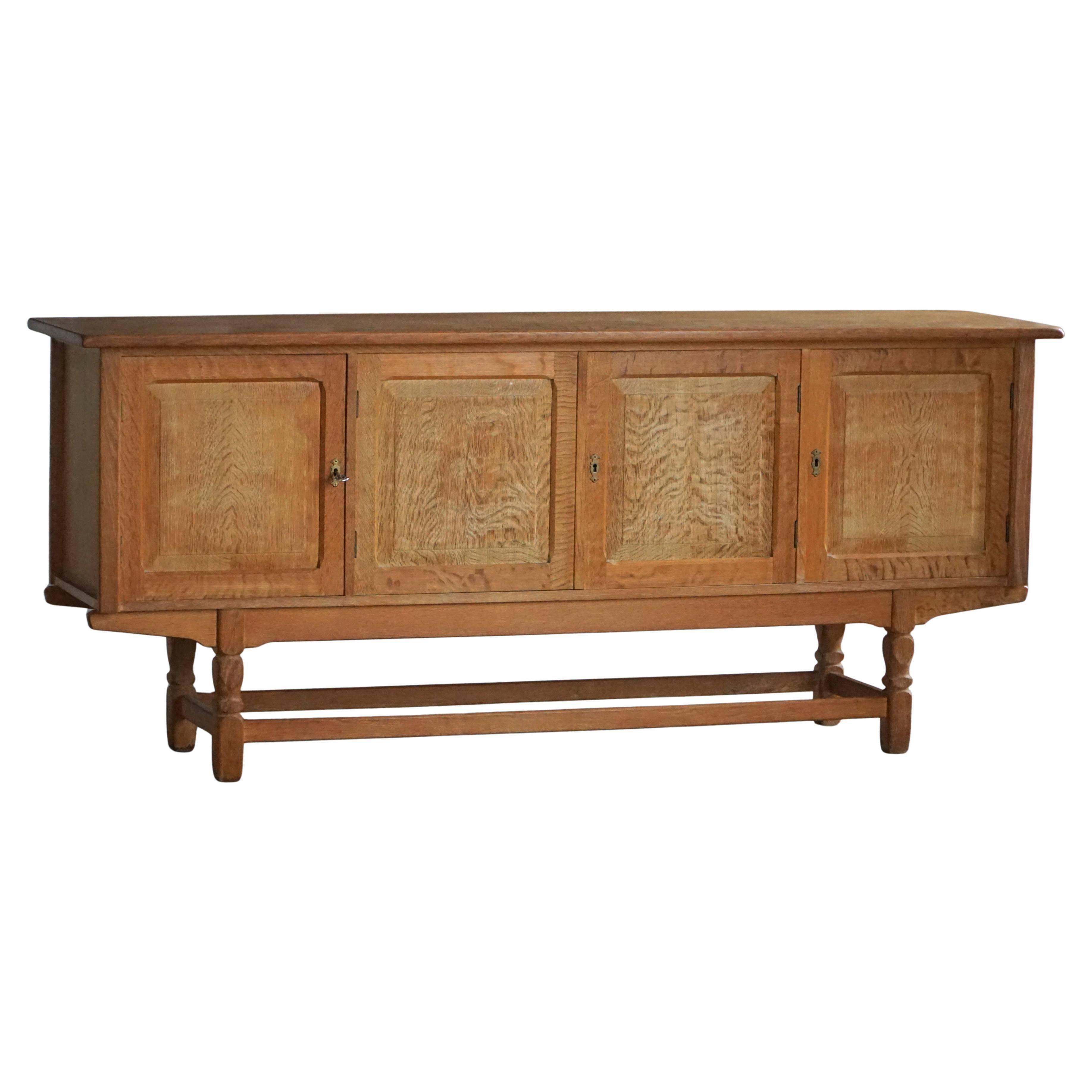 Low oak sideboard, mid-century modern, made by a Danish cabinetmaker, 1960s.
