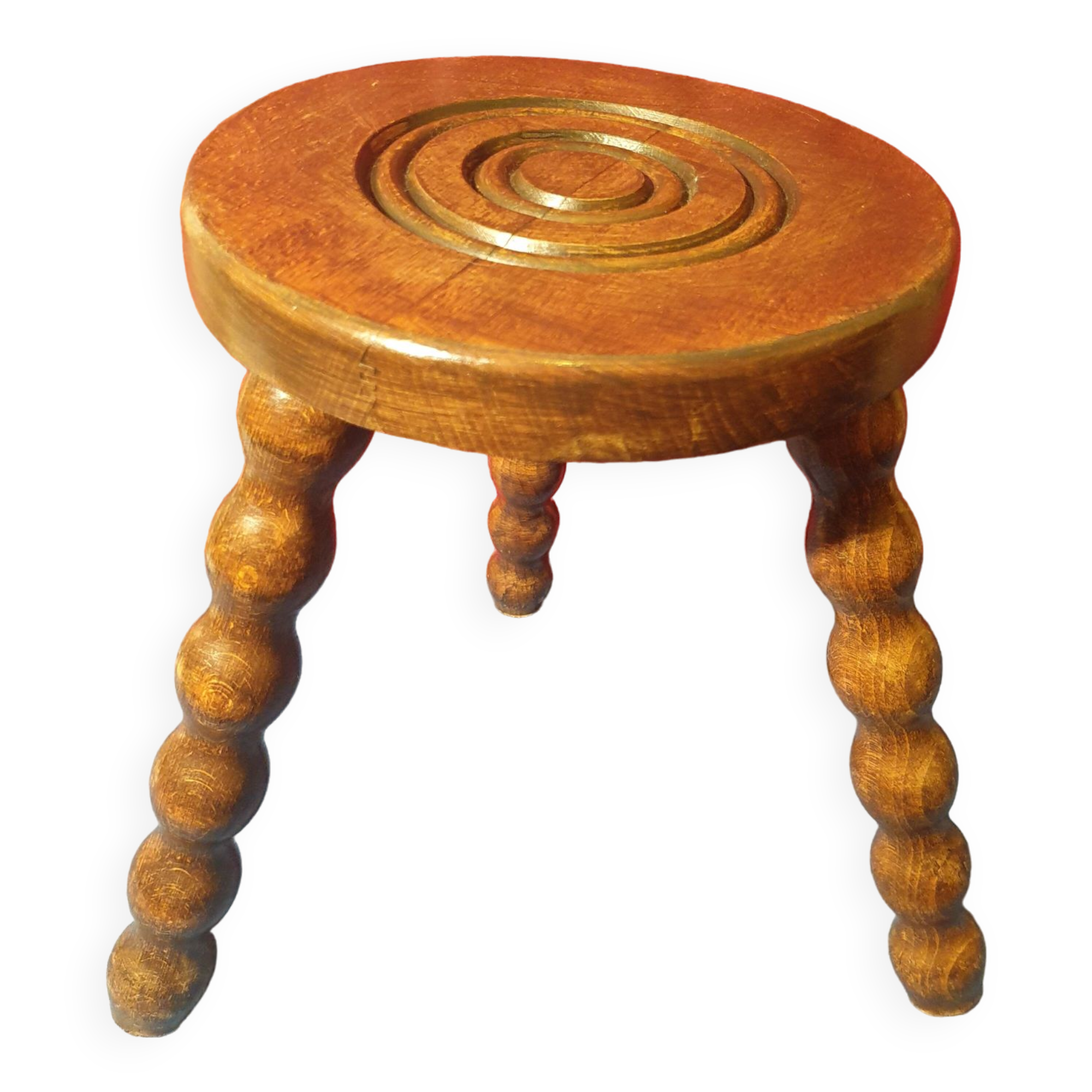 Wooden milking stool with twisted legs