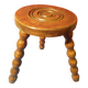 Wooden milking stool with twisted legs