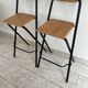 2 foldable bar stools from the 90s in wood and black metal