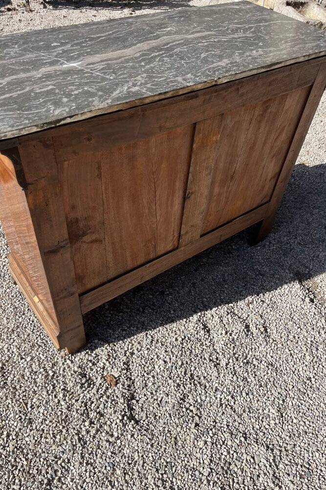 Antique chest of drawers with a grey marble top.