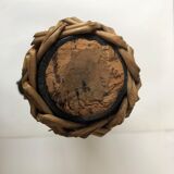 Amber and wicker glass bottle