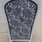 Voltaire style armchair covered in floral fabric in quality aged wood