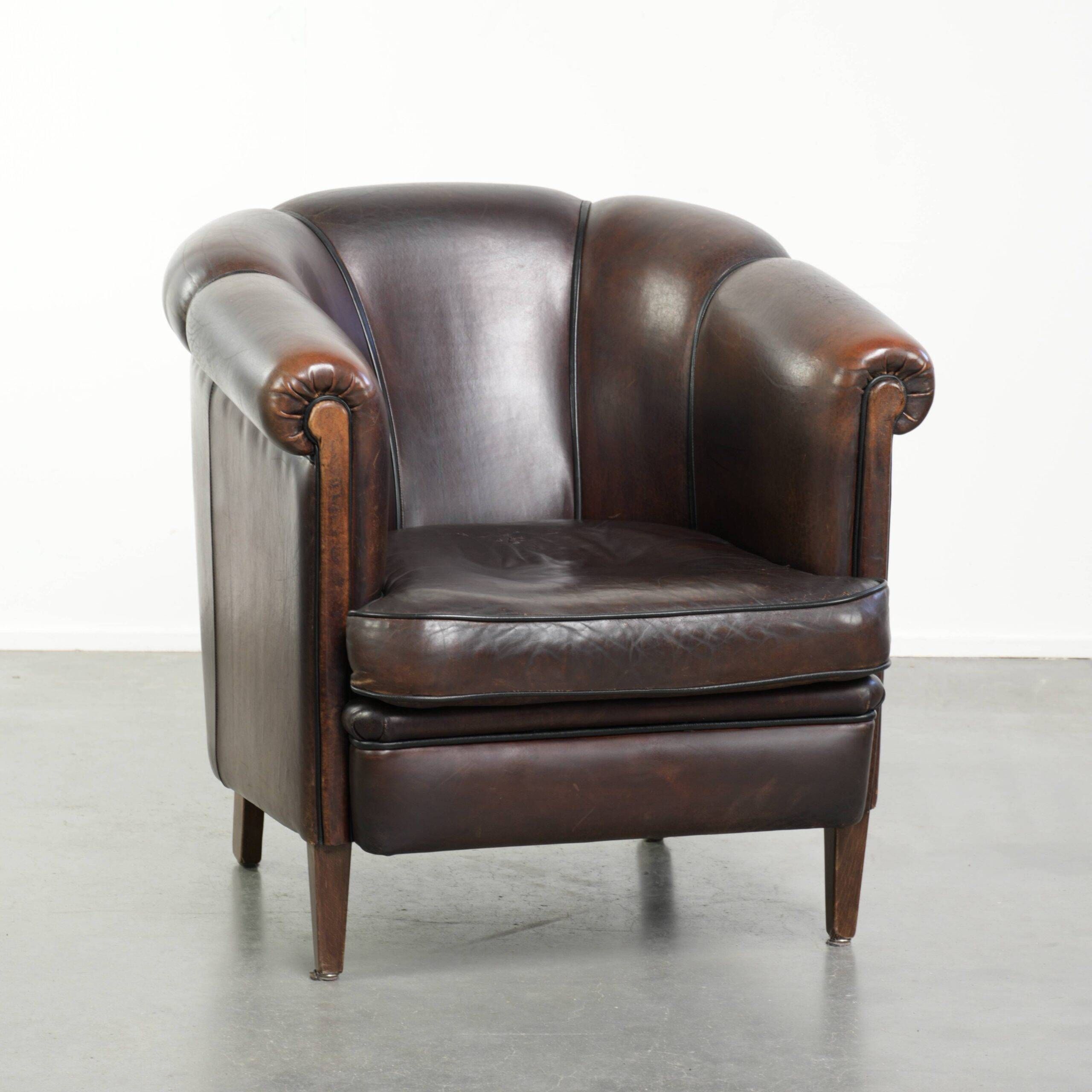 Dark sheepskin club armchair with unique design in English style