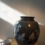 Black vase with plant decoration by Philippe Jacques