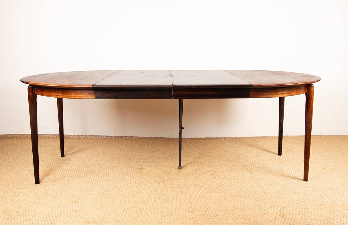 Danish extendable dining table in rosewood by Kai Lyngfeldt Larsen.