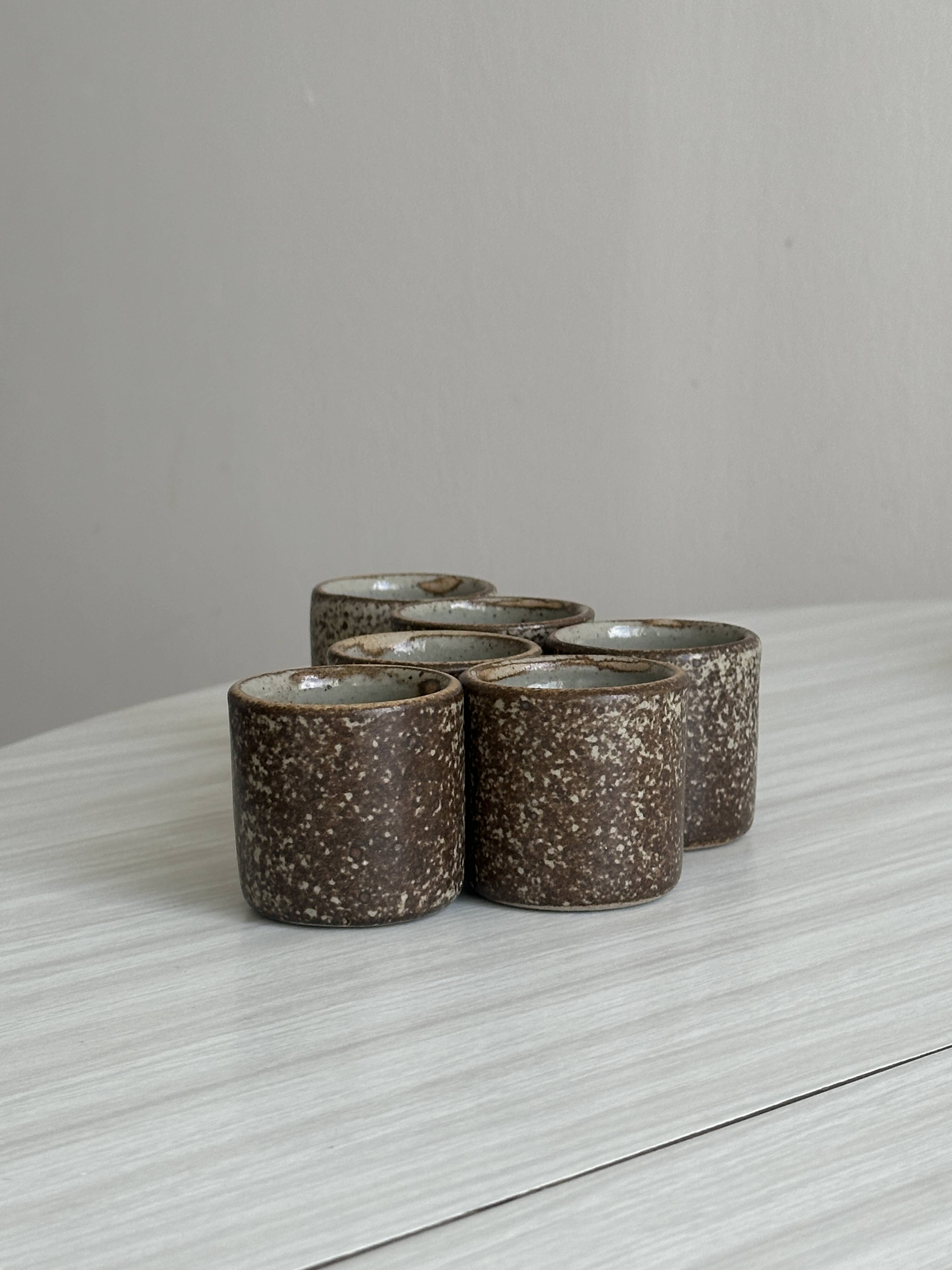 Handcrafted stoneware set of 6 liqueur glasses and matching plate