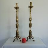Pair of bronze and brass torch candlesticks