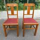 Pair of Art Deco chairs in solid oak and burgundy leather from around 1940.
