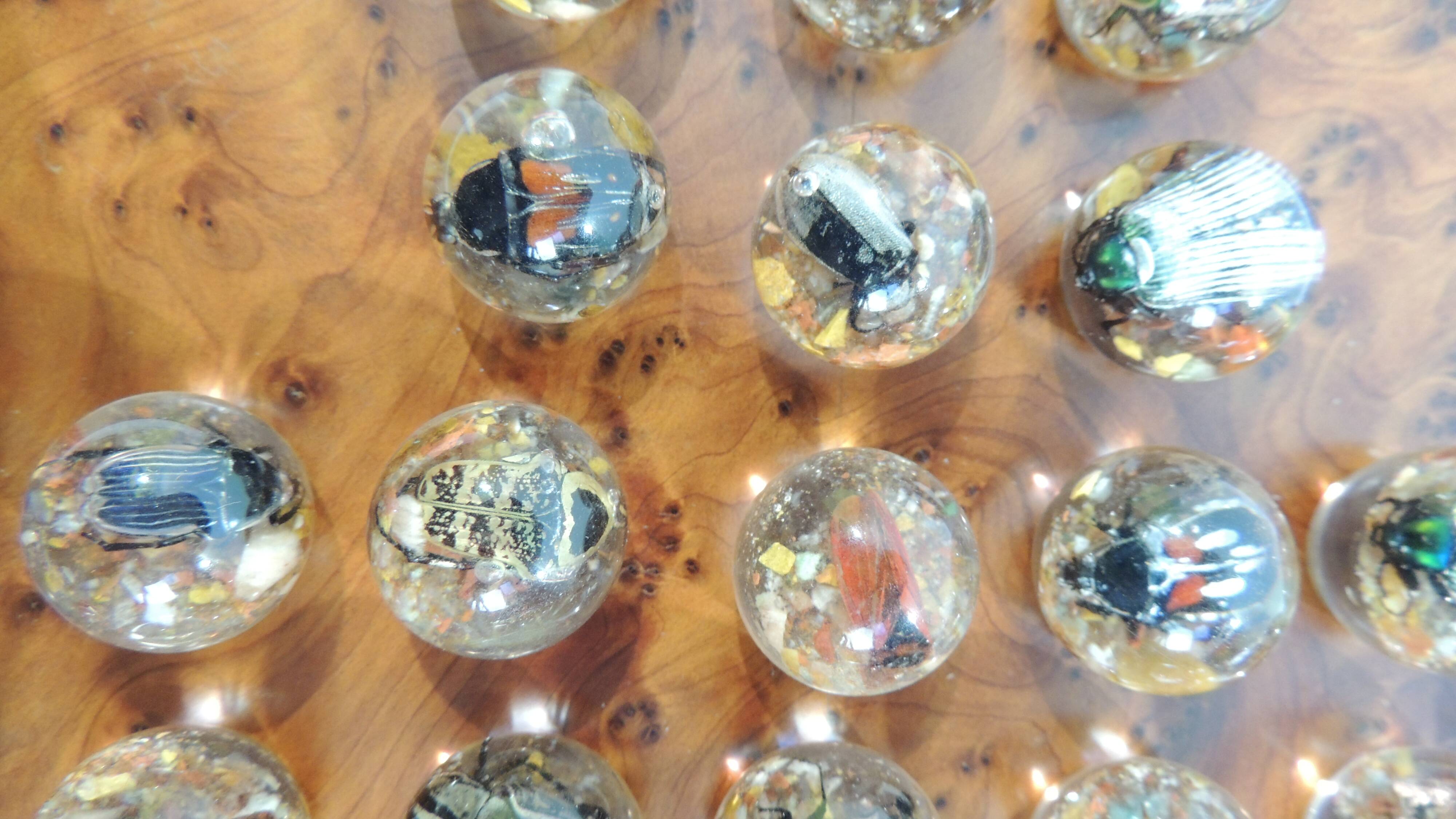 Vintage wooden solitaire game with resin balls and insects – Madaga
