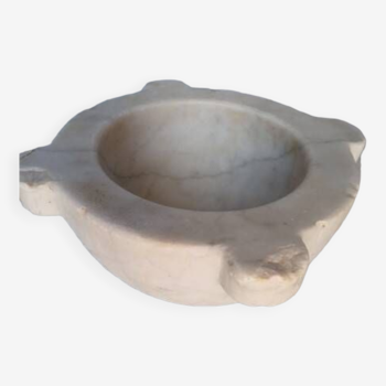 Old marble mortar with ears