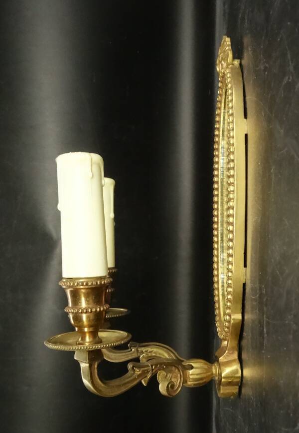 Paire d'appliques-miroirs style Louis XVI - bronze