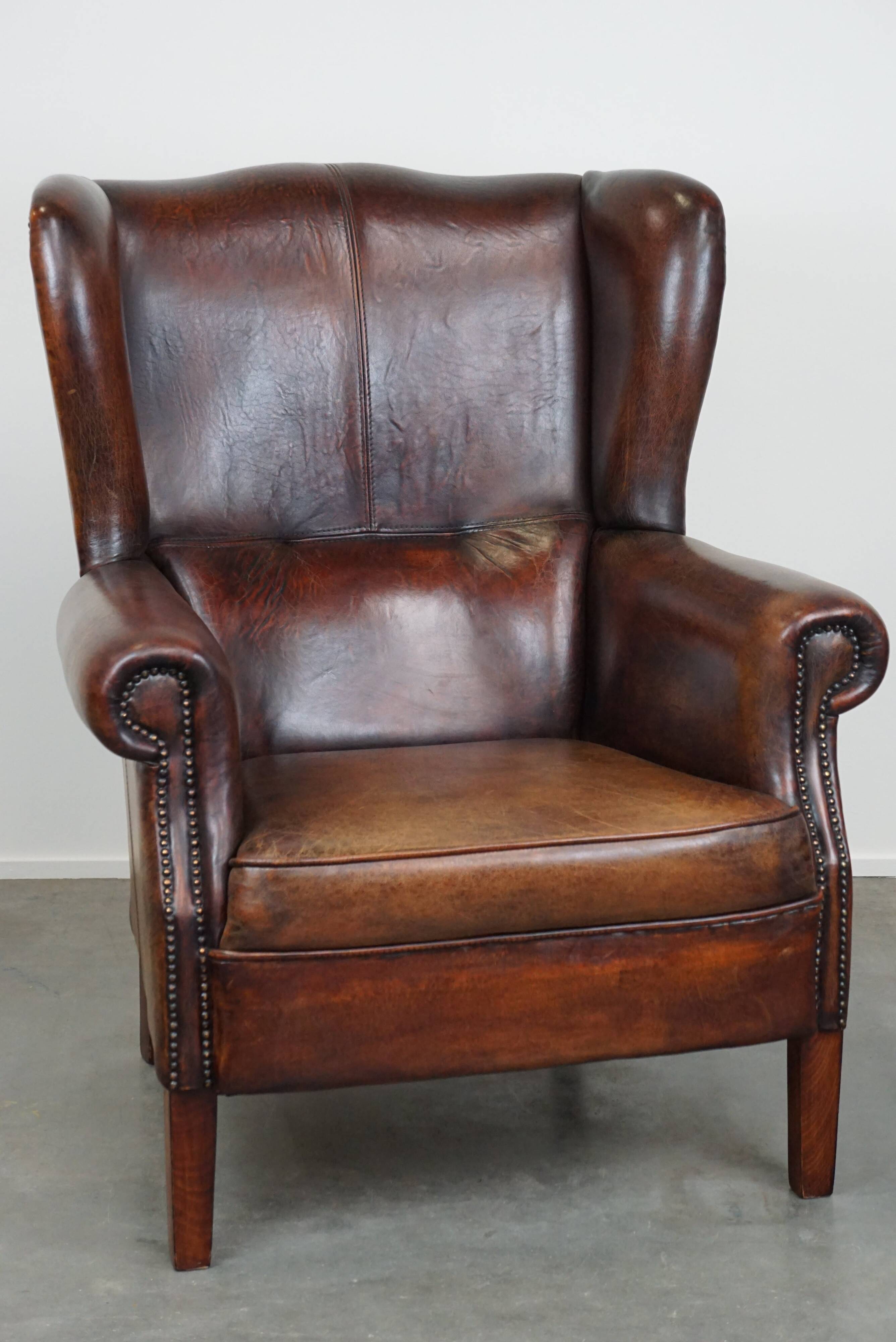 Large Sheepskin Leather Wingback Armchair with a Fixed Seat Cushion and a Stunning Patina