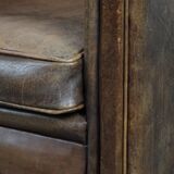 Vintage sheepskin armchair with warm colours and a characterful appearance