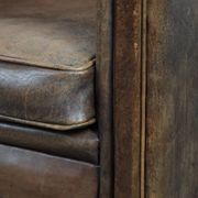 Vintage sheepskin armchair with warm colours and a characterful appearance