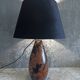 Carved wooden lamp with floral motif