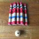 Former wooden tricolor bowling game with its ball