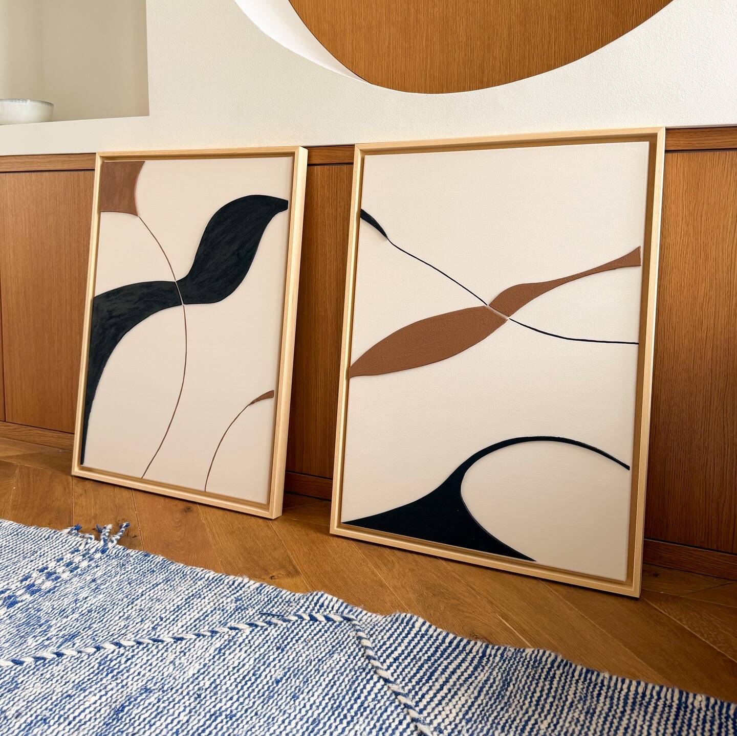 Beige, black, brown diptych design panels.