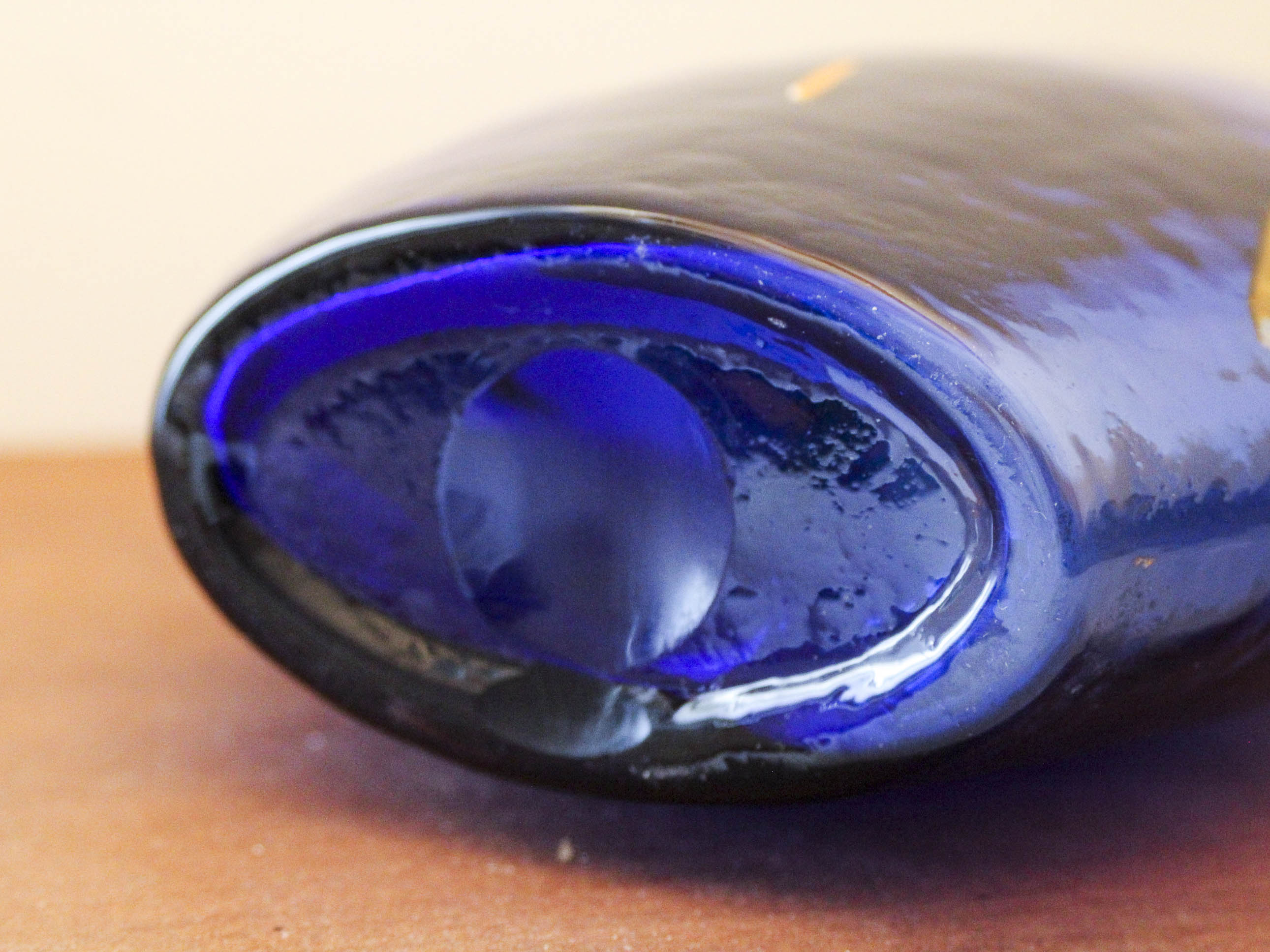 Blue blown glass vase and orange inclusion