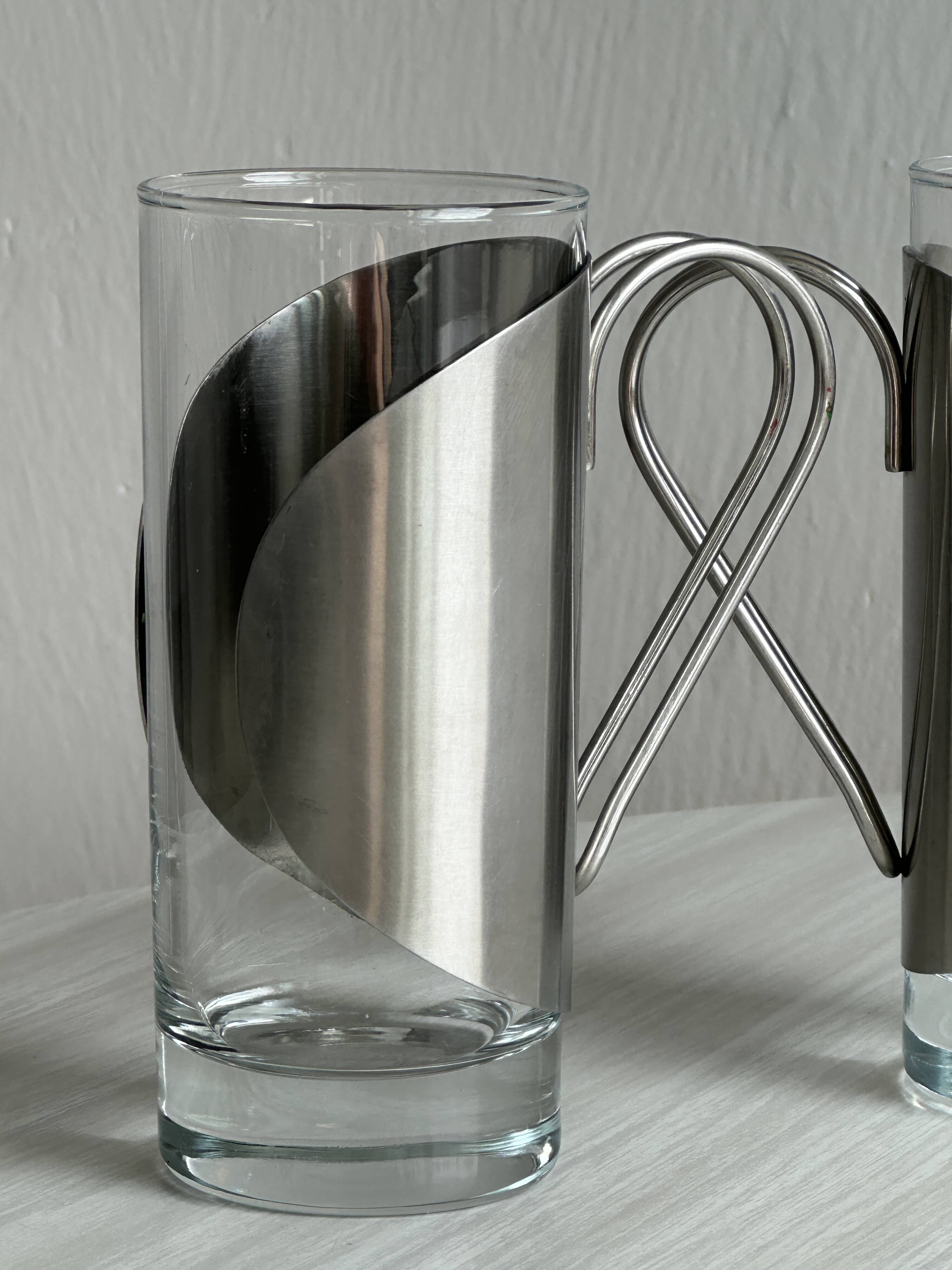 2 glasses with metal handles, stainless steel.