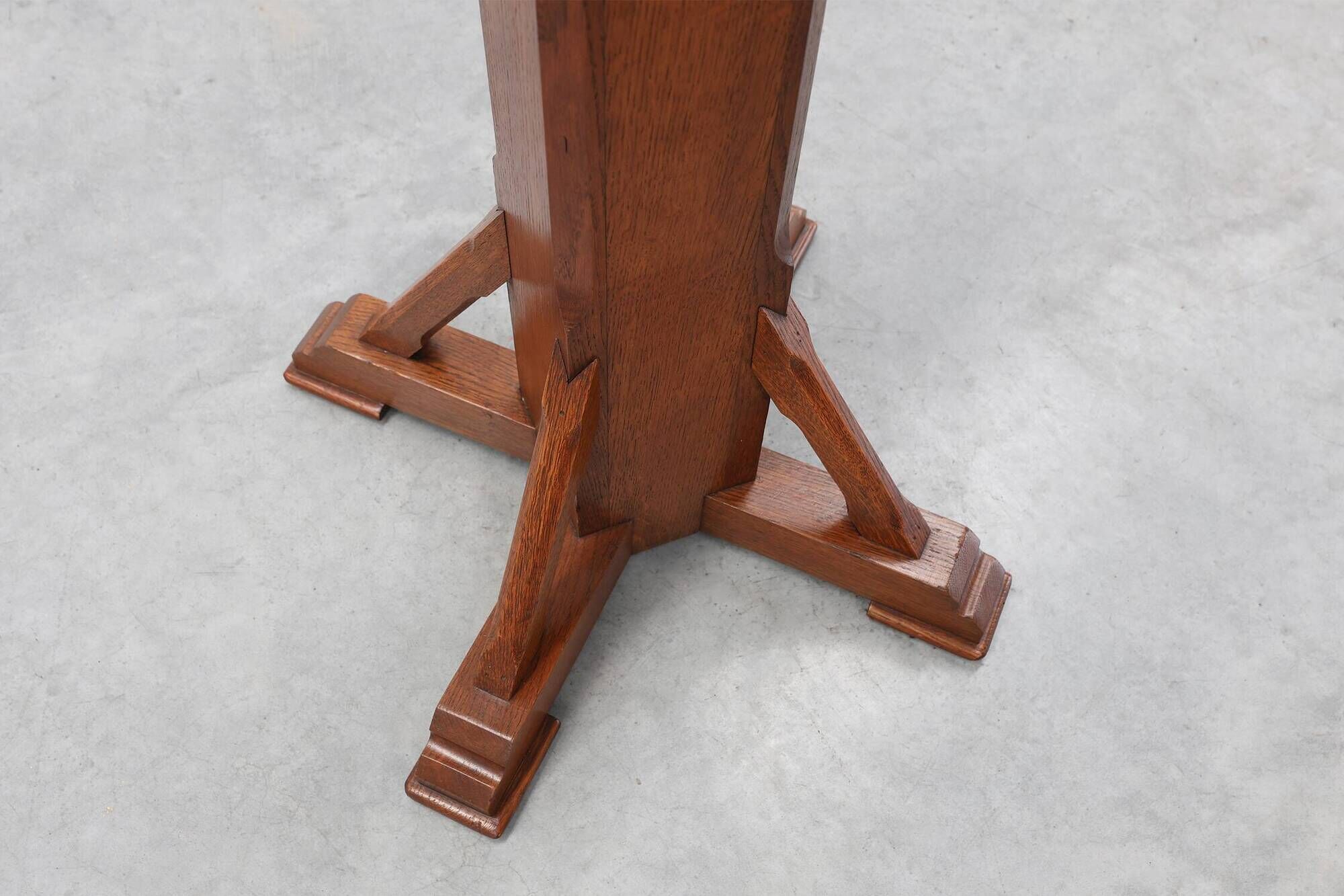 Art Deco oak pedestal with pierced brackets and cross base, Belgium 1920s
