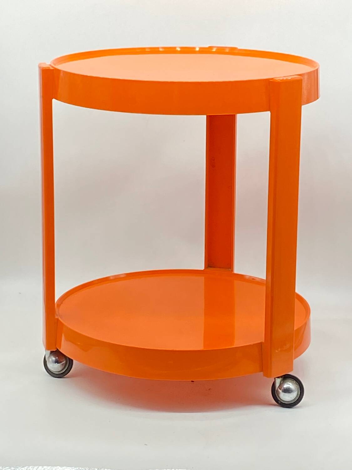 Vintage / designer / orange plastic rolling trolley,
