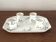 Egg cups on a Limoges porcelain tray by Bernardaud with a barbel decoration.