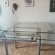 High table with tempered glass and chrome base.