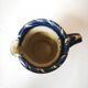 Enamelled ceramic blue pitcher signed by the artist