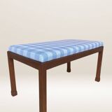 Ottoman coffee table in wood and gingham fabric.